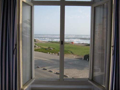 an open window with a view of the ocean at Jetty Self-Catering in Swakopmund