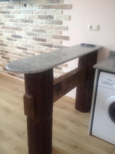 a wooden counter with a skateboard on top of it at Nodari in Batumi