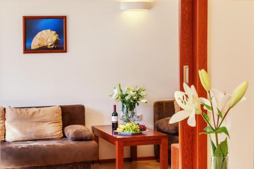 a living room with a couch and a table at Columbus Rowy in Rowy