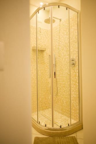 a shower with a glass enclosure in a bathroom at Villa Carlotta Minori in Minori