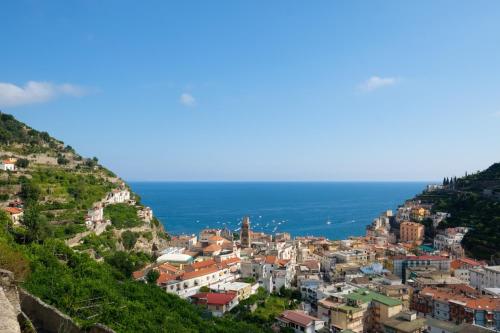 a view of the city of positano on a hill at Villa Carlotta Minori in Minori