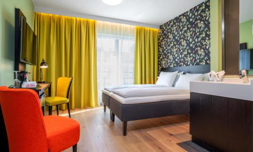 Säng eller sängar i ett rum på Thon Hotel Gyldenløve