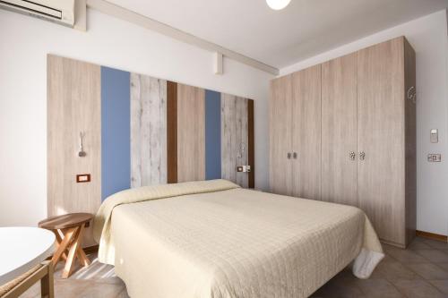 Кровать или кровати в номере Apparthotel San Sivino