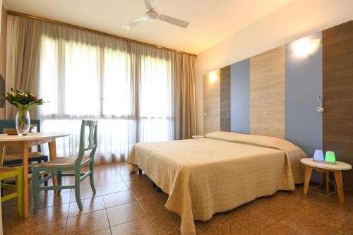Кровать или кровати в номере Apparthotel San Sivino