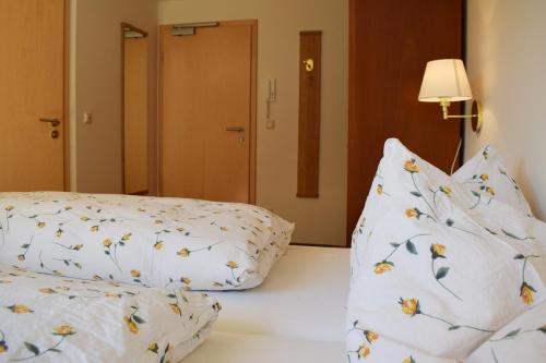 a bedroom with two pillows on a bed at Haus Partale in Oberstdorf