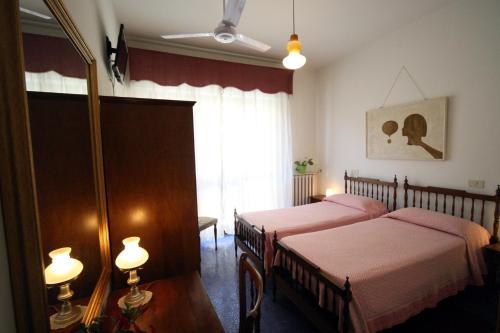 Postel nebo postele na pokoji v ubytování Albergo I Longobardi