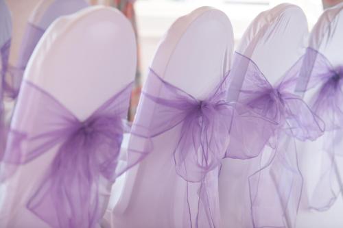 a group of white wedding dresses with bows on them at The Royal Hotel in Oban