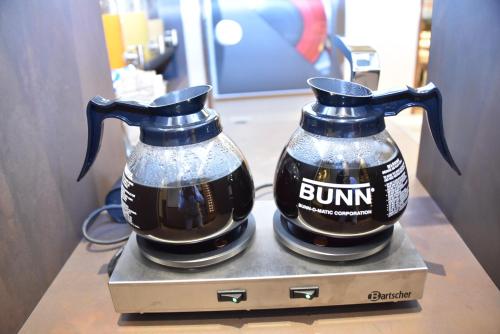 two bottles of rum sitting on top of a box at Solo Experience Hotel in Florence