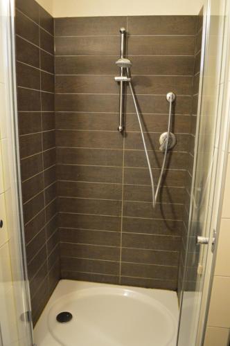 a shower stall with a toilet in a bathroom at Hostaria da Lino in San Marino