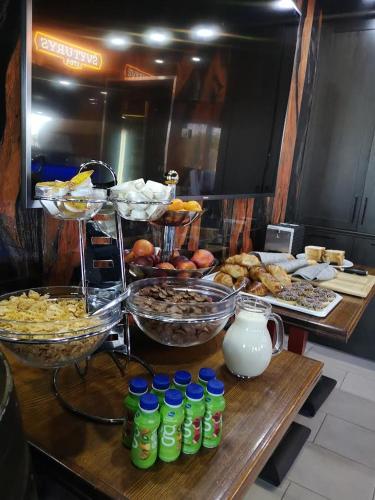 a buffet with many different types of food and drinks at Resort Hotel Elija in Šventoji