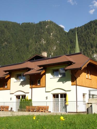 a large building with a brown roof at Chalet Helene in Mayrhofen