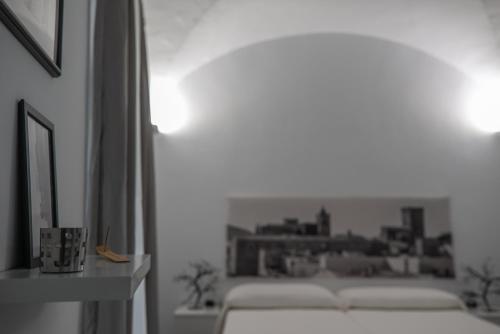 Ένα ή περισσότερα κρεβάτια σε δωμάτιο στο Apartamentos Turísticos Domus Seleqtia Plaza Mayor
