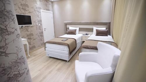 Ένα ή περισσότερα κρεβάτια σε δωμάτιο στο Florya House Hotel