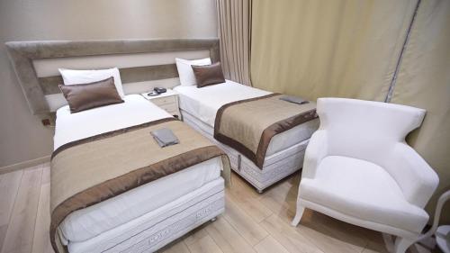 Ένα ή περισσότερα κρεβάτια σε δωμάτιο στο Florya House Hotel