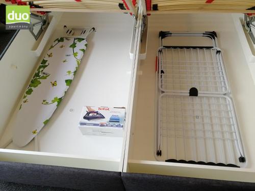 a room with a bunk bed with a shelf at Apartmány Duo in Dačice