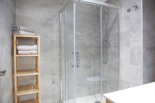 a shower with a glass door in a bathroom at NEW LOFT ATOCHA Centre in Madrid