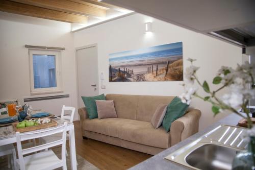 a living room with a couch and a table at Le Dimore Di Puglia - Palazzo Pinto in Monopoli