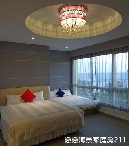 Postel nebo postele na pokoji v ubytování 南灣飯店 Kenting Nanwan Hotel