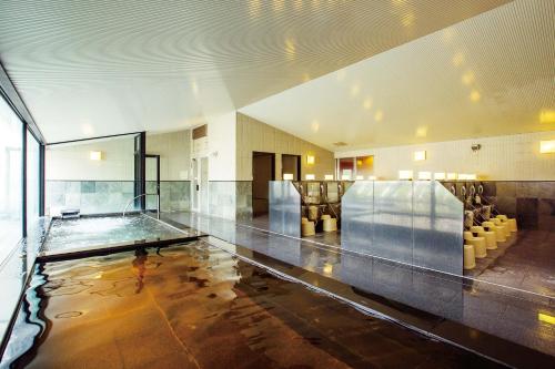a large room with a pool of water in a building at Hotel Emion Tokyo Bay in Tokyo