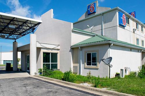a building with a sign on the side of it at Motel 6-Seymour, IN - North in Seymour