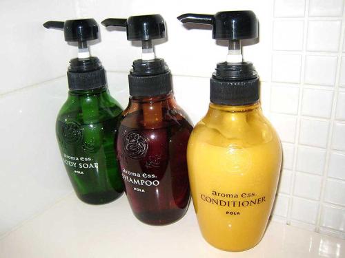 three bottles of condiments sitting on a counter at Hotel Gracery Tokyo Tamachi in Tokyo