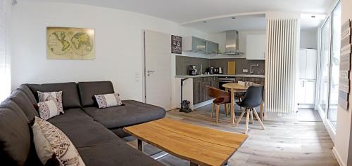 a living room with a couch and a table at Haus Josef Klotten Wohnung 2 in Klotten