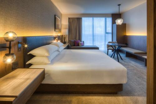 a hotel room with two beds and two lamps at Hyatt Regency Andares Guadalajara in Guadalajara