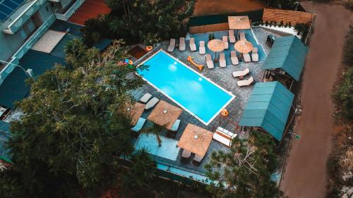 an overhead view of a swimming pool with a resort at Almirikia Apartments in Mourteri
