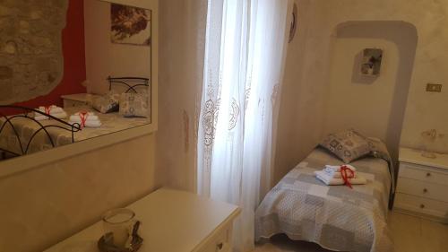 Ένα ή περισσότερα κρεβάτια σε δωμάτιο στο B&B Casale Shanti