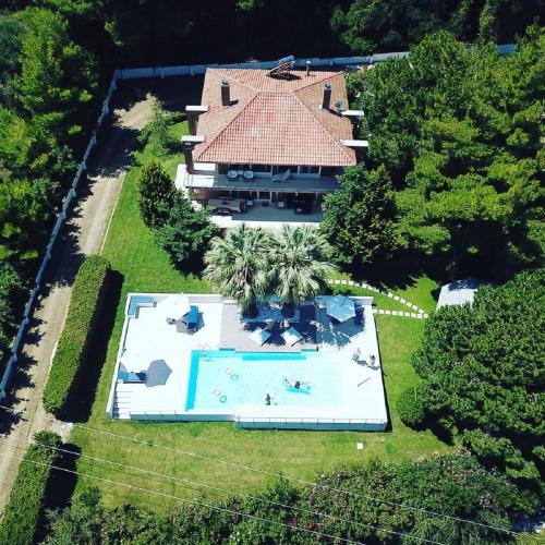 an overhead view of a house with a swimming pool at Villa Anna Maria in Kriopigi