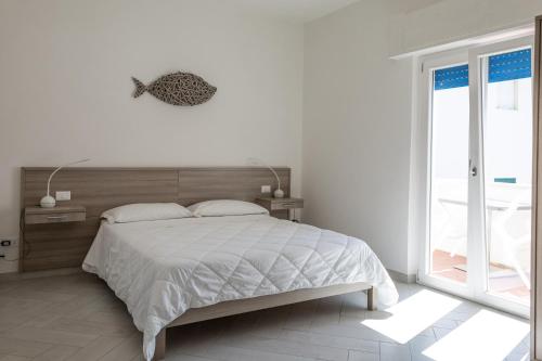 En eller flere senge i et værelse på La Conchiglia sul Mare