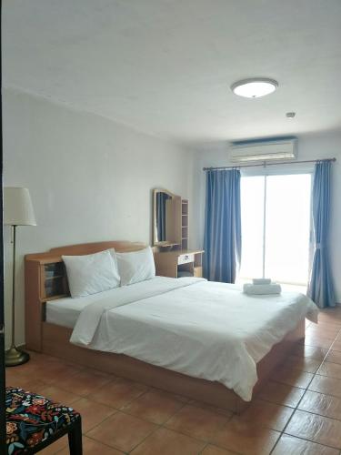Ένα ή περισσότερα κρεβάτια σε δωμάτιο στο Lomsabai Apartments