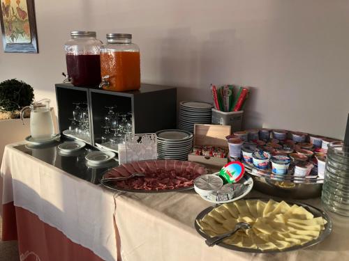 a table with some food and drinks on it at Hotel Romagna in Baveno