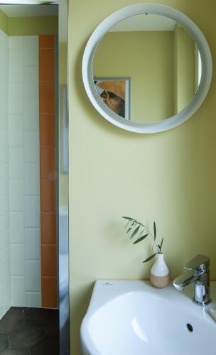 a bathroom with a sink and a mirror on the wall at I Registi in Scalea
