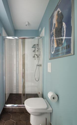a bathroom with a shower and a toilet in it at I Registi in Scalea