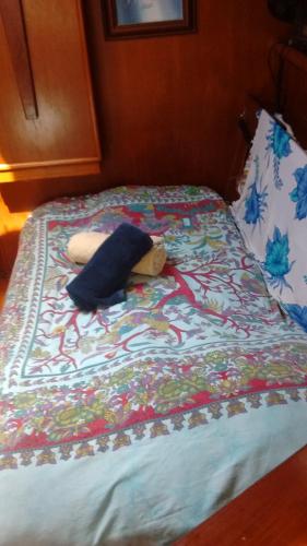 a stuffed animal laying on top of a bed at Play to Live San Blas in El Porvenir