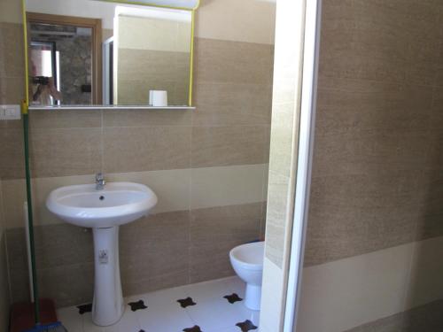 a bathroom with a sink and a toilet at Mafrolla Carlo in Vieste