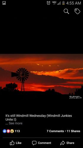 an image of a sunset with a windmill at Yellowstone House of the Three Bears 2 Blocks to Downtown in Cody