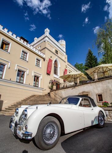 a white car parked in front of a building at Chateau St. Havel - Wellness Hotel in Prague