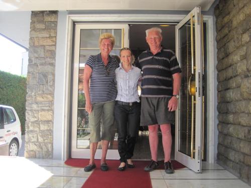 a group of three people standing in front of a door at Hotel Matilde in Marina di Massa