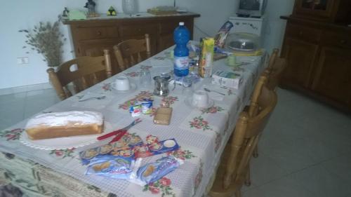 a table in a kitchen with a table cloth on it at B&B Le Rose in Vignacastrisi