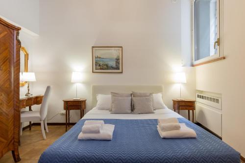 Een bed of bedden in een kamer bij Residenza Giulietta Capuleti