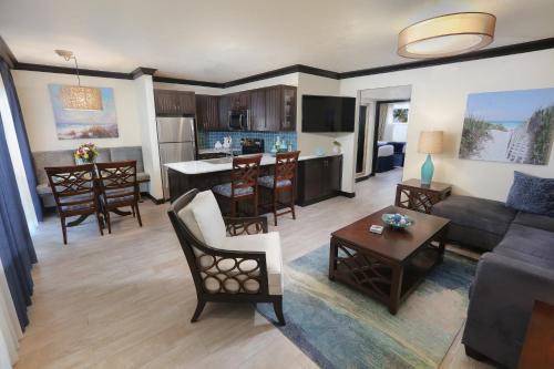 a large living room with a couch and a kitchen at Westgate Cocoa Beach Resort in Cocoa Beach