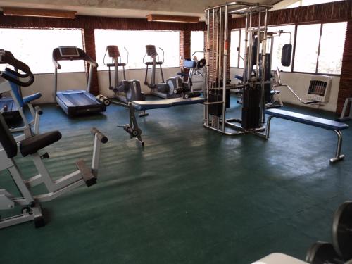 a gym with several tread machines in a room at Bosques de Monterreal in Mesa de las Tablas
