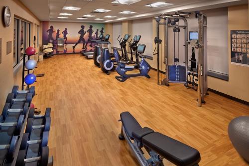 a gym with several treadmills and cardio machines at Hyatt Place Warwick/Providence Airport in Warwick