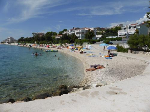 a group of people laying on a beach at Ferienwohnung Dalmatien in Dugi Rat