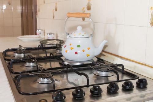 a tea kettle sitting on top of a stove at Casa Del Grande Vecchio in Airasca
