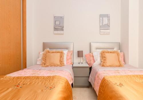Posteľ alebo postele v izbe v ubytovaní Residential jardín del pintor - la casa amarilla