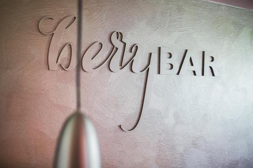a wall with the wordianeauder written on it at IMbery Hotel & Restaurant Hinterzarten in Hinterzarten