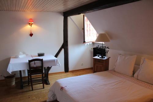 Postel nebo postele na pokoji v ubytování B&B La Tête dans les Etoiles